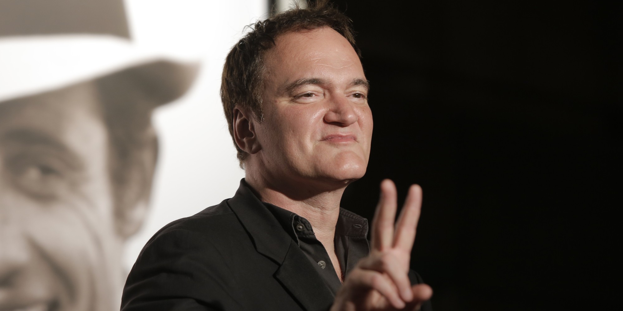Director Quentin Tarantino gestures as he arrives at the 5th edition of the Lumiere Festival, in Lyon, central France, Monday, Oct. 14, 2013. (AP Photo/Laurent Cipriani)